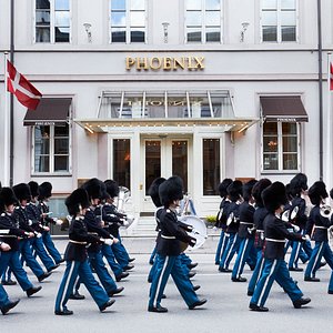 Main entrance at Phoenix Copenhagen with The Royal Guards walking by.