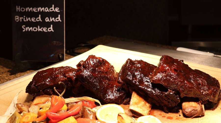 Feast on ribs. Have all you can eat smoked meats slathered in homemade sauces for lunch or dinne