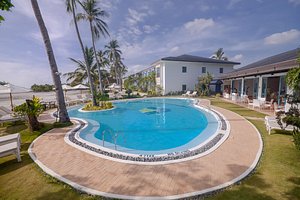 Microtel by Wyndham Puerto Princesa, Palawan in Palawan Island, image may contain: Resort, Hotel, Villa, Pool