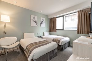 Taichung Box Hotel in North District, image may contain: Bed, Furniture, Dorm Room, Chair