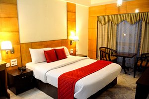 Hotel City Centaur in Bengaluru, image may contain: Hotel, Resort, Chair, Furniture