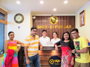Hotel Sher-E-Punjab in Gangtok, image may contain: People, T-Shirt, Table, Pants