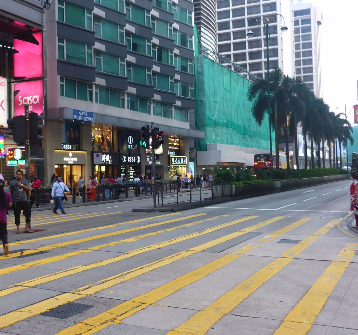 A pedestrian walks past a De Beers SA store in Hong Kong, China