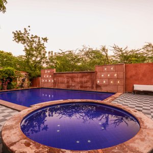 Swimming Pool with baby pool around Garden. 