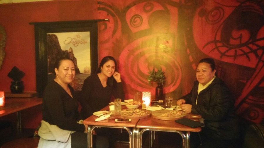 3 ladys enjoying some great pizza's