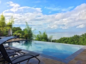 Ocean Suites Boutique Hotel in Bohol Island, image may contain: Scenery, Pool, Swimming Pool, Chair