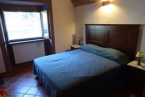 Albergo Miramonti in Castelnovo ne' Monti, image may contain: Furniture, Bed, Bedroom, Indoors