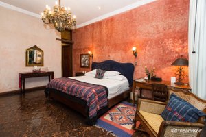 Meson Panza Verde in Antigua, image may contain: Chandelier, Lamp, Home Decor, Bed