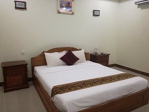 Angkor Meas Hotel in Stung Treng, image may contain: Bed, Furniture, Corner, Cushion