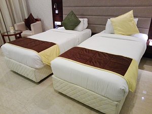 Hotel Khanna Fiesta in Vellore, image may contain: Furniture, Bed