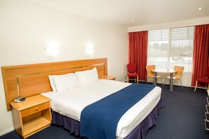 Edgewater in Devonport, image may contain: Furniture, Chair, Dorm Room, Bedroom