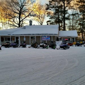Ample parking for your vehicle, trailer, and sled.  Miles of groomed trails just off the propert