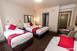 City Square Motel in Melbourne, image may contain: Furniture, Bed, Bedroom, Indoors
