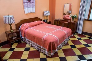 Pan American Hotel in Guatemala City, image may contain: Bed, Furniture, Bedroom, Indoors
