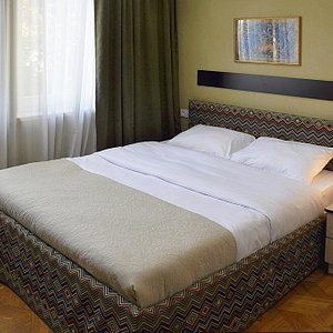 Hotel Frida in Tbilisi, image may contain: Furniture, Bed, Bedroom, Painting