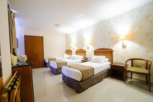 Bethlehem Hotel in Bethlehem, image may contain: Furniture, Chair, Hotel, Bed