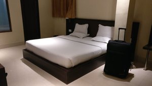 Hotel Kalash in Tezpur, image may contain: Furniture, Bed, Handbag, Bag