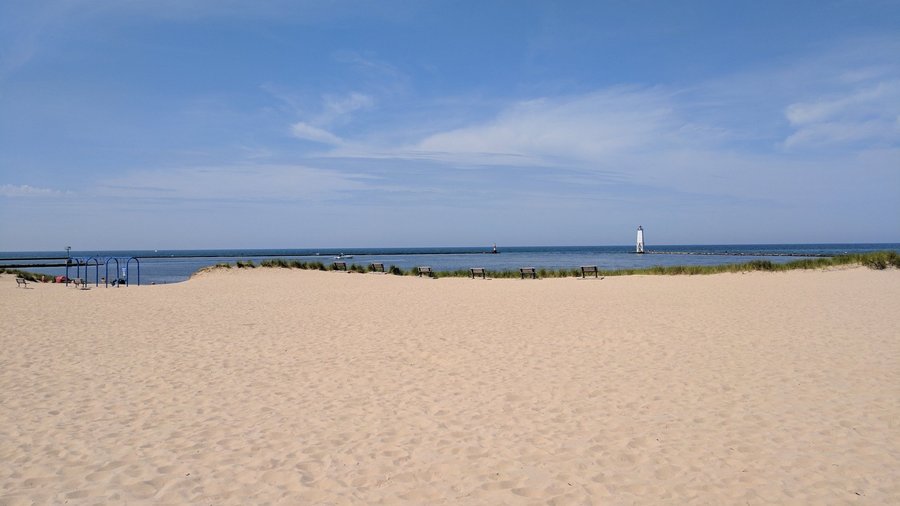 Wide view of beach & lighthouse