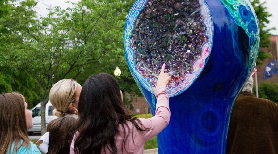 Locals admire one of the #artbulbs downtown ("GeoBulb" by Sharon Passmore, 2017)