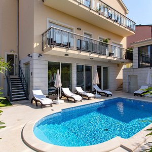 OASI - BOUTIQUE HOTEL & RESTAURANT in Pula, image may contain: Villa, Pool, Hotel, Chair