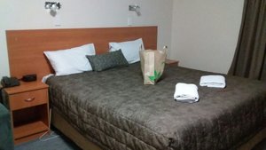 Clare Central Motel in Clare, image may contain: Furniture, Bed, Handbag, Dorm Room