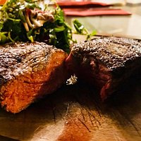 10oz sirloin steak, sweet potato fries, chimichurri sauce, mixed leaves and cherry tomato salad.