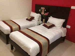 5 Falls Resort in Courtallam, image may contain: Furniture, Bed, Bedroom, Room