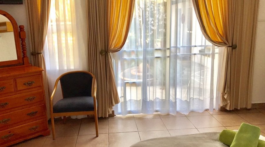 Sun room, sleep 2. King or 2 twin beds on request. Door to patio. En suite shower. 