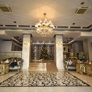Imperial Palace Hotel in Yerevan, image may contain: Chandelier, Lamp, Lighting, Reception Room