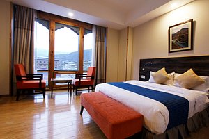 Hotel Thimphu Towers in Thimphu, image may contain: Penthouse, Furniture, Hotel, Bed