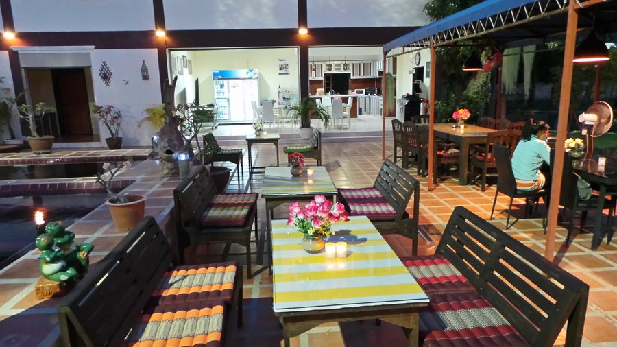 In addition to a beautifully landscaped garden with a large pond you can take a seat...