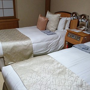 Hilltop Hotel in Chiyoda, image may contain: Dorm Room, Bed, Furniture, Bedroom
