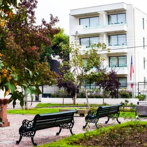 Heidelberg Haus Apart Hotel in Santiago, image may contain: Furniture, Bedroom, Bed, Indoors