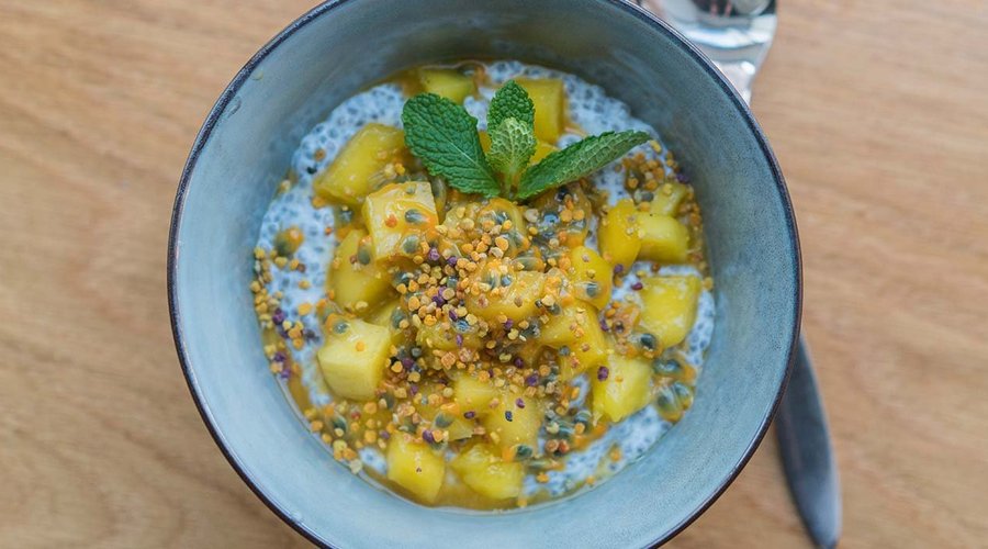 Chia Pudding with seasonal fruit and bee pollen.