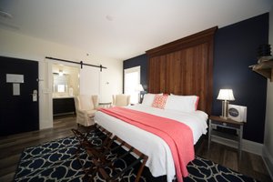 The Anchor Inn Boutique Hotel in Put in Bay, image may contain: Home Decor, Interior Design, Furniture, Bedroom
