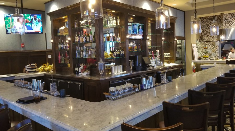 Our gorgeous wrap around bar is the perfect place to take in a game or happy hour with friends!