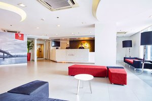 Red Planet Cebu in Cebu Island, image may contain: Living Room, Furniture, Foyer, Table