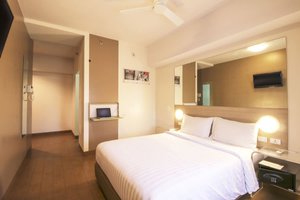 Red Planet Cagayan de Oro in Mindanao, image may contain: Corner, Bed, Furniture, Bedroom