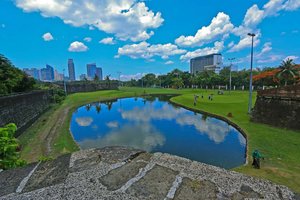 Red Planet Manila Aseana City in Luzon, image may contain: Pond, Nature, Outdoors, Grass