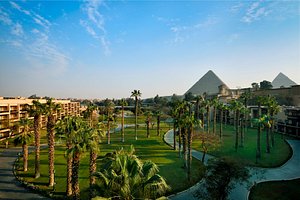 Marriott Mena House, Cairo in Giza, image may contain: Resort, Hotel, Building, Grass