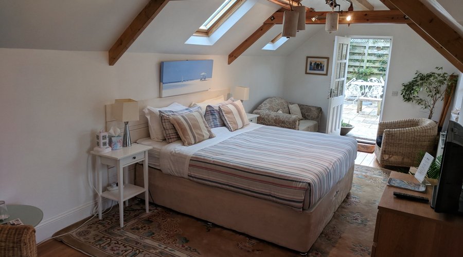 Garden room with shared bathroom. Can be a twin or super king. Can also accommodate x2 extra bed
