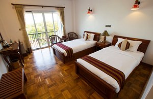 Yadanarpon Dynasty Hotel in Mandalay, image may contain: Wood, Hotel, Resort, Bed