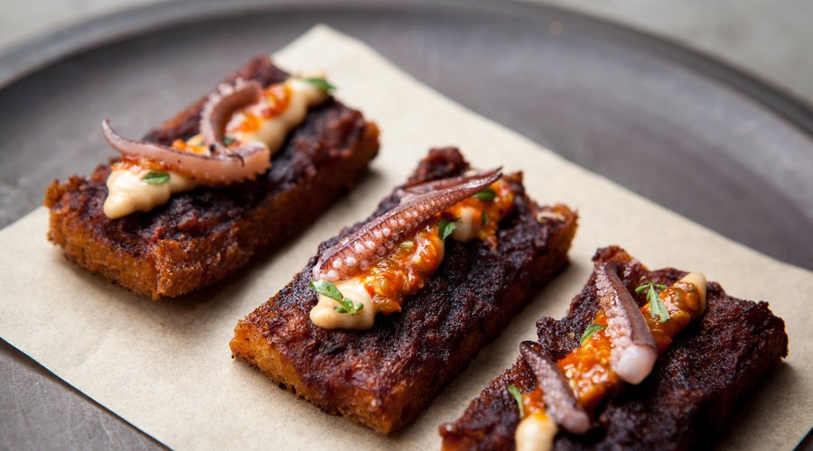 Fried squid toast, smoked almond cream, yuzu kosho chermoula, native mint.