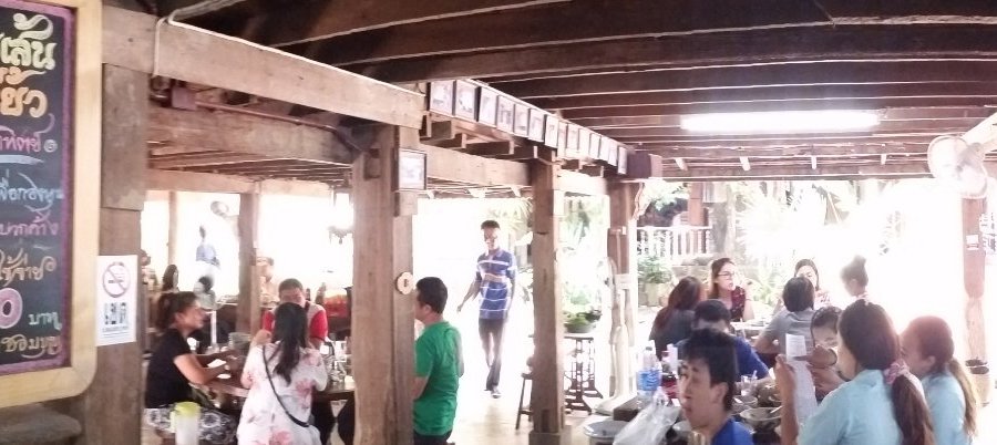 The wood interior is warm and charming and you can point at the wall side menu to keep ordering 