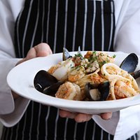 Enzo's trademark spaghetti al sapore di mare with fresh local seafood