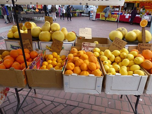 Fruit and vegetables stand and shoppers, Ferry Terminal Market