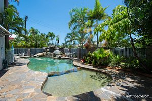 Reef Palms in Cairns, image may contain: Backyard, Walkway, Pool, Villa