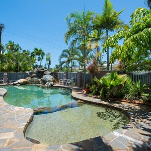 Reef Palms in Cairns, image may contain: Backyard, Walkway, Pool, Villa