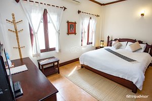 Villa Meuang Lao in Luang Prabang, image may contain: Furniture, Bed, Bedroom, Indoors