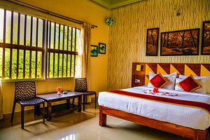 Honeydewwz Exoticaa Hotel & Resort in Chikmagalur, image may contain: Hotel, Furniture, Bed, Interior Design